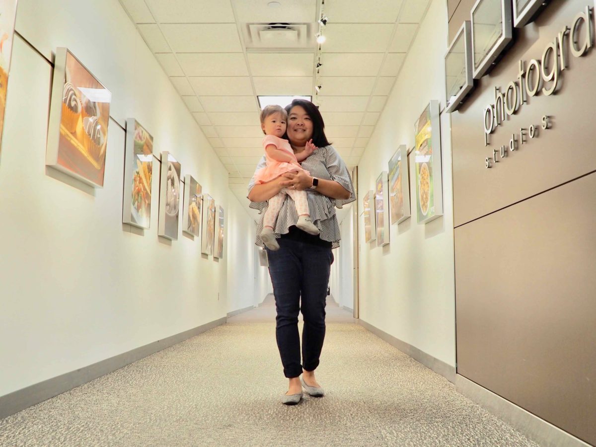 General Mills employee Aimee Mortenson holding her daughter