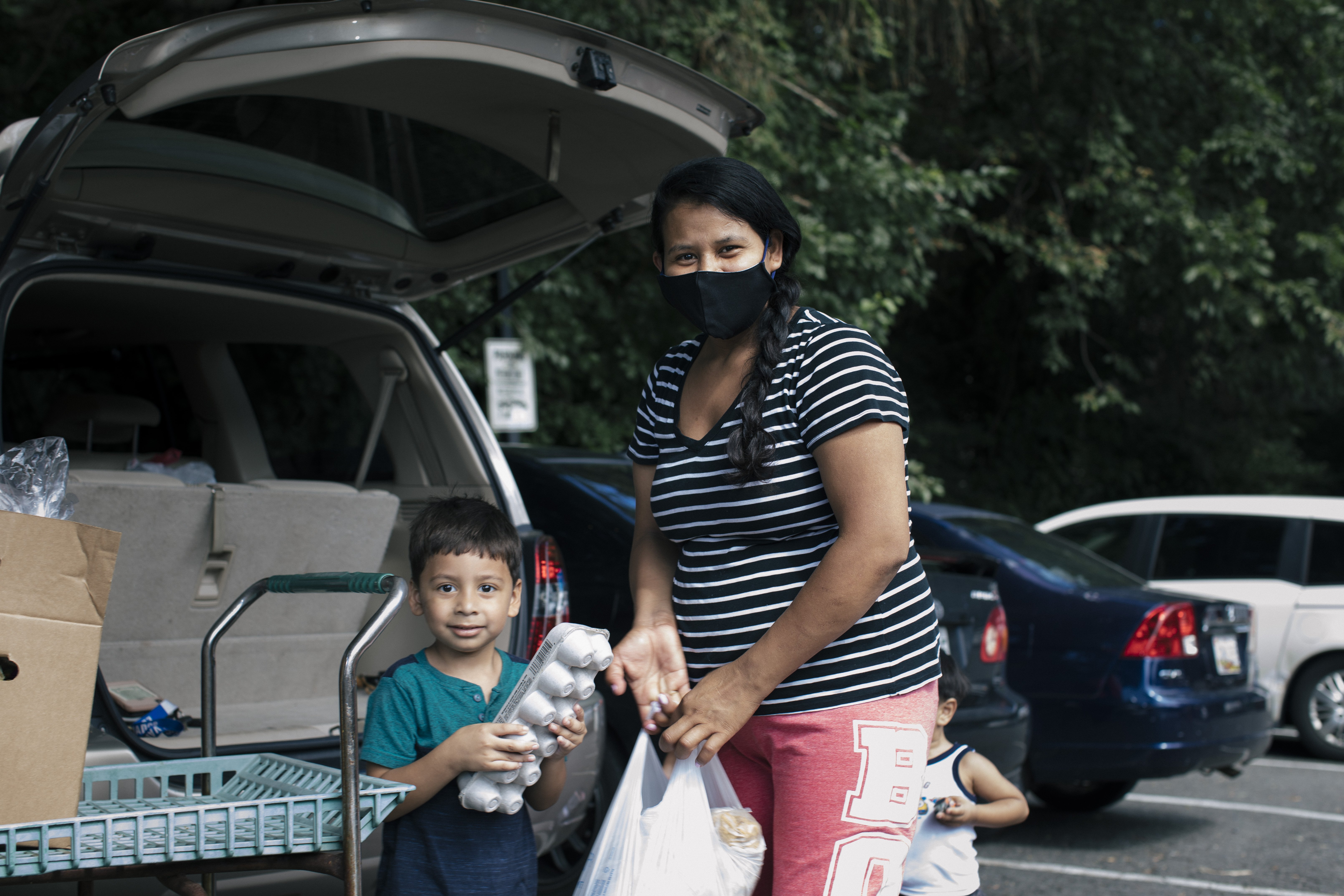 Mom and son picking up food donations